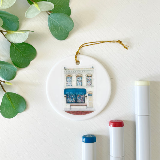 Capitol Hill Books | White Ceramic Ornament with Gold Tassel